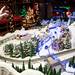 Charles Elkins points out a detail in his North Pole display in his basement on Monday. This display has two working trains which he says the kids really enjoy. "I tell people I hope you enjoy it as much as i did making it," Elkins says. Daniel Brenner I AnnArbor.com